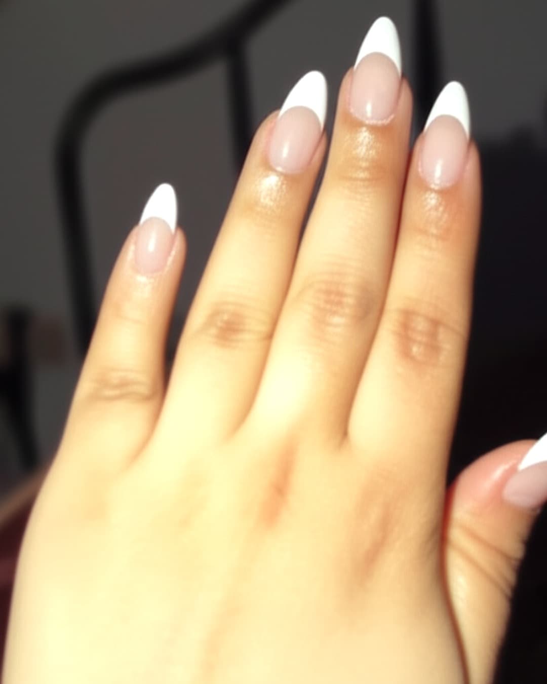 Dramatic white French tips on long stiletto nails