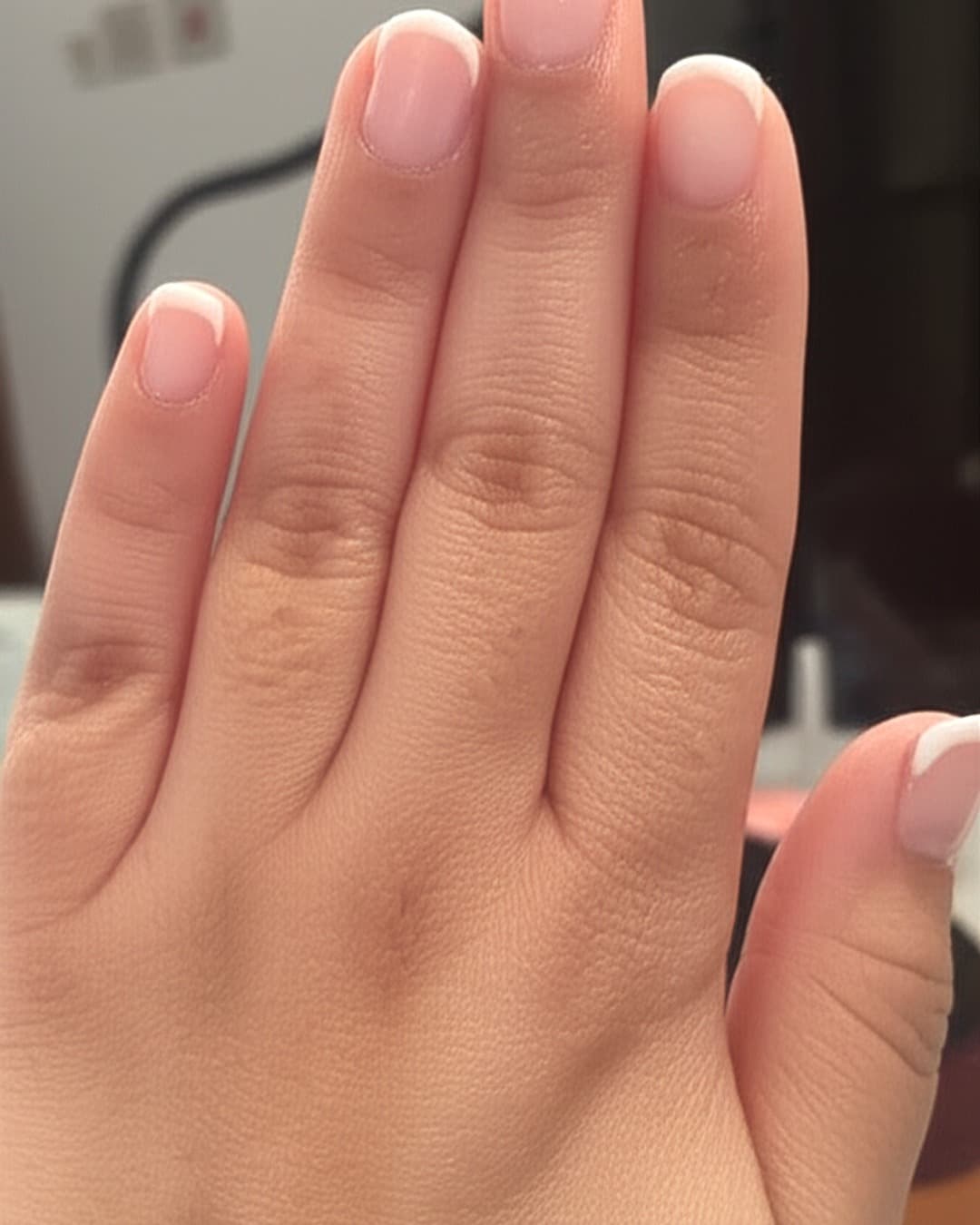 White micro French tips on short round nails