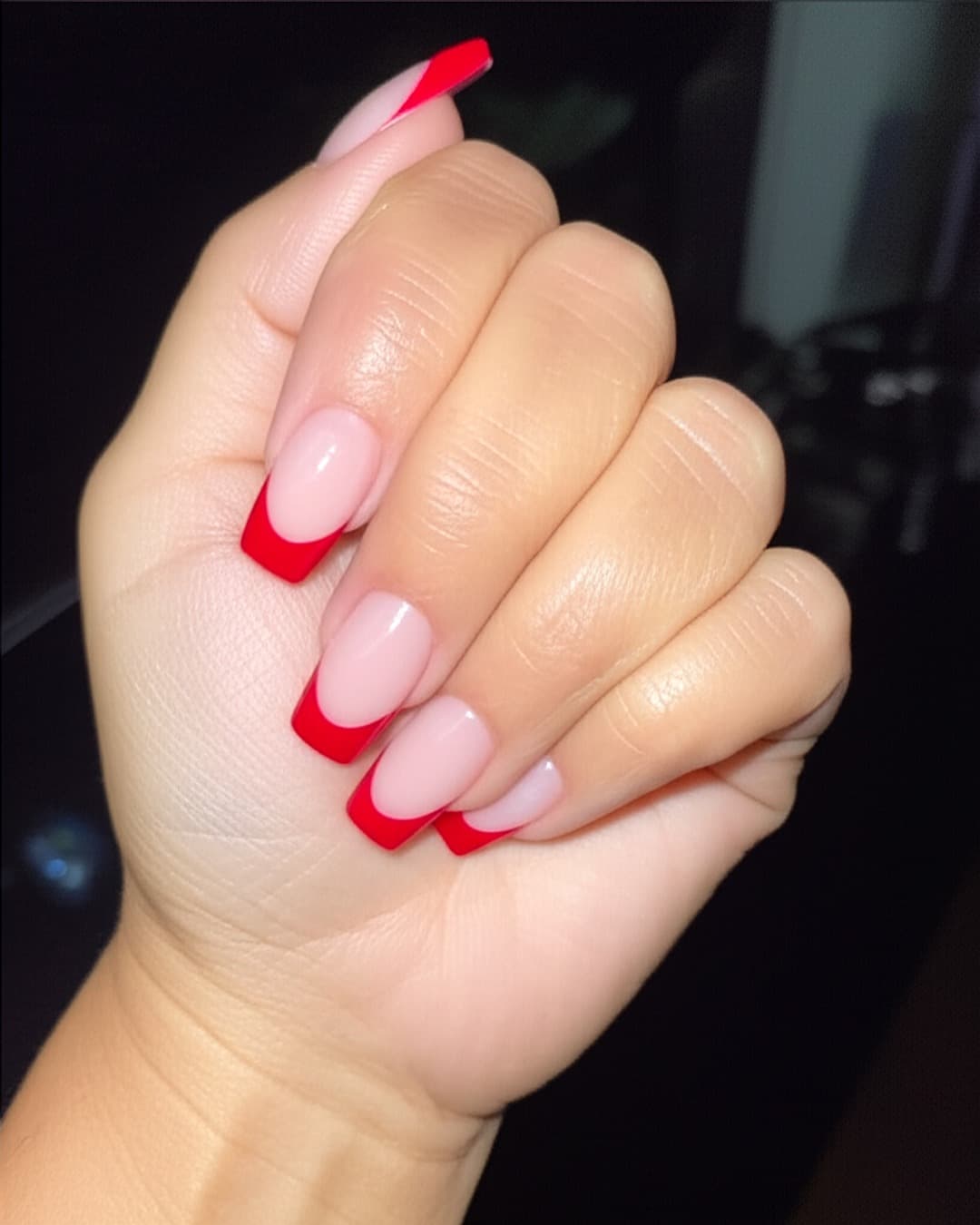 Red French tips on almond nails