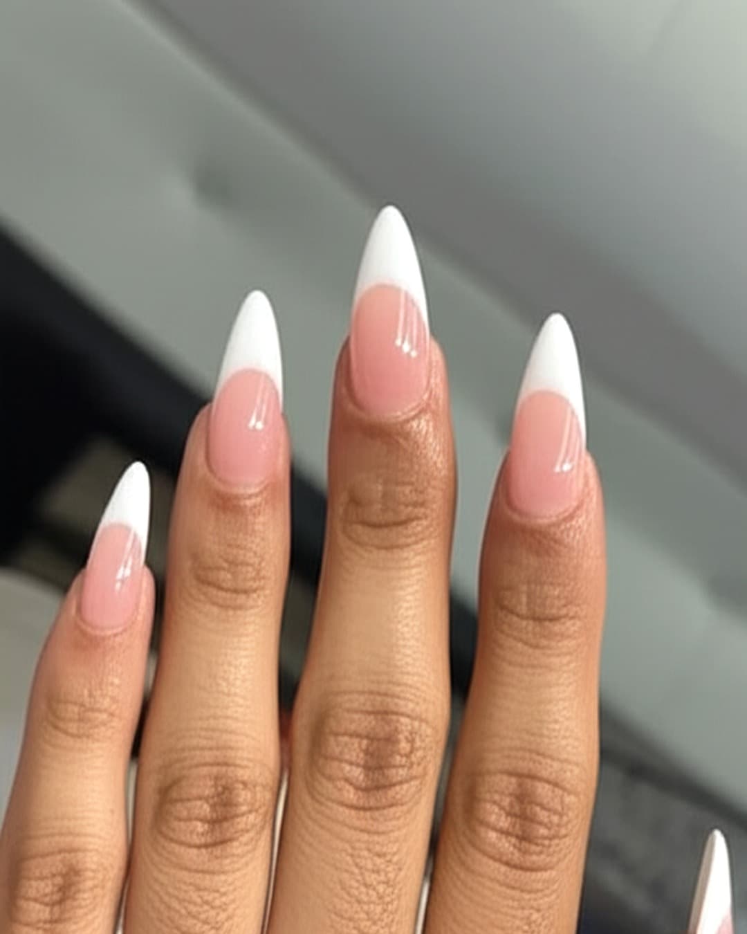 White French tips on long stiletto nails