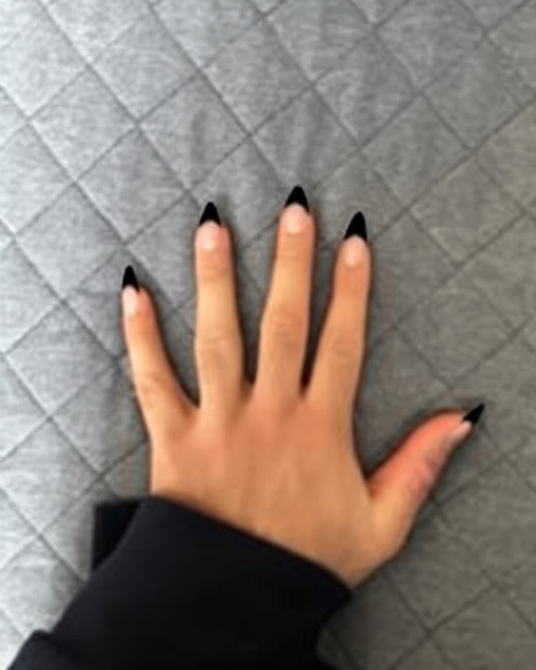 Black French tips on long stiletto nails